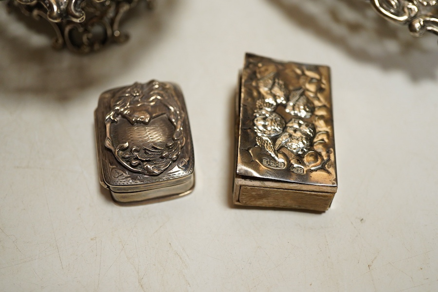 A collection of silver to include a late Victorian heart shaped pierced and embossed footed bonbon dish, London, 1901, William Comyns, another heart shaped bonbon dish, a French silver mounted pepper mill, a matchbox sle